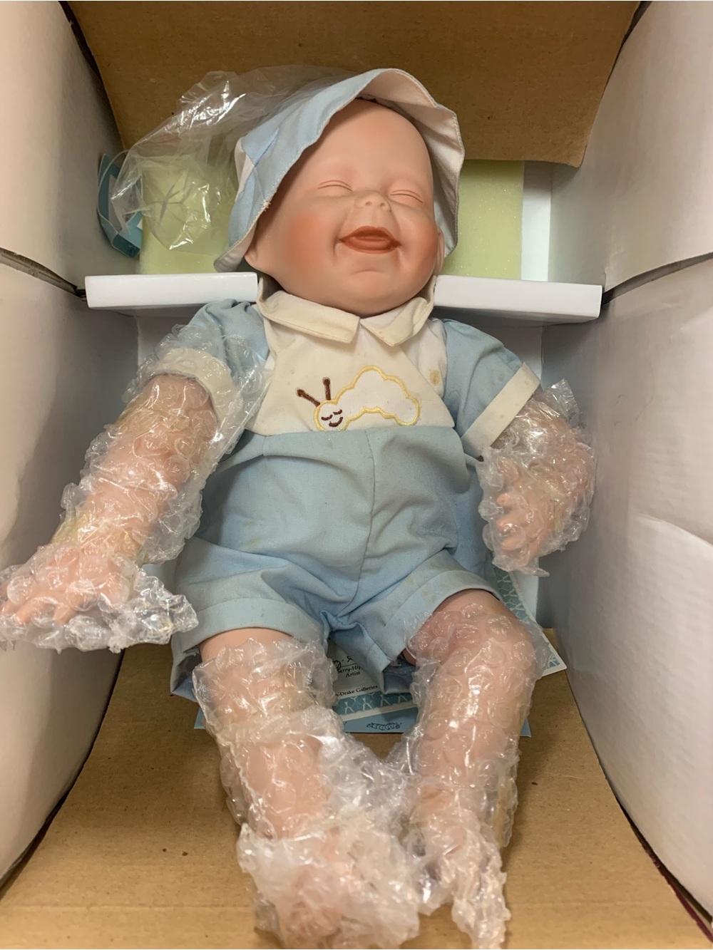 Smiling Baby Doll in Light Blue Outfit by Ashton Drake. Inv 904 Baby is Tickles